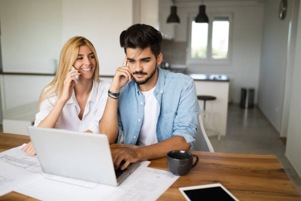 istock Handsome young man and attractive woman working on laptop 1045369092