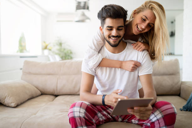 istock Young attractive couple spending time together at home 1045369180