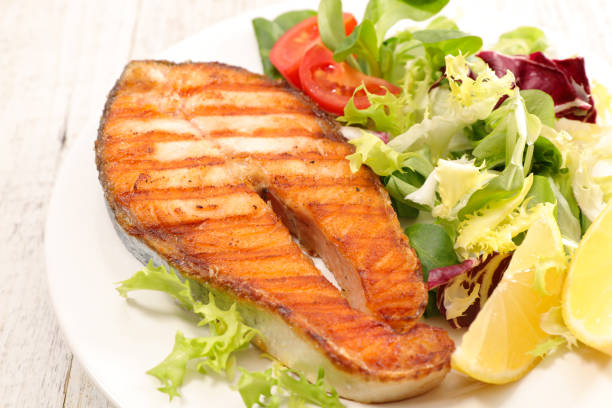 istock grilled salmon steak and salad 1045372608