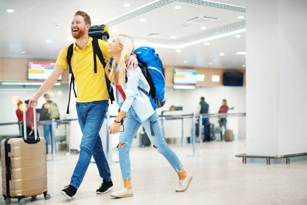 istock Young couple at an airport. 1045373126