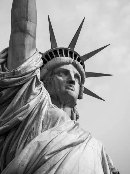 Looking up at the face and crown of the statue of liberty