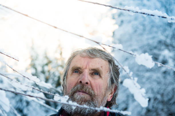 istock Senior Mountaineer in Alps, Winter 1045381418