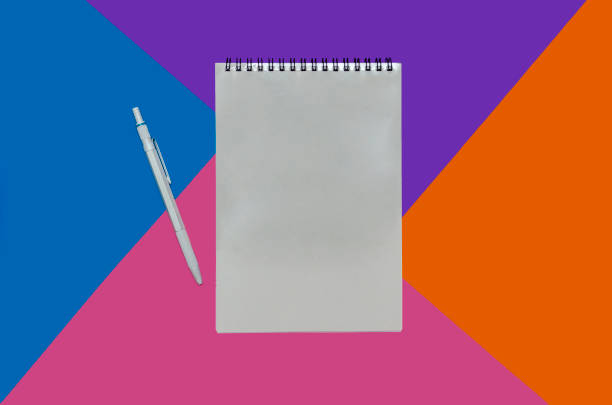 istock Isolated shot of opened spiral notebook on white background 1045383096