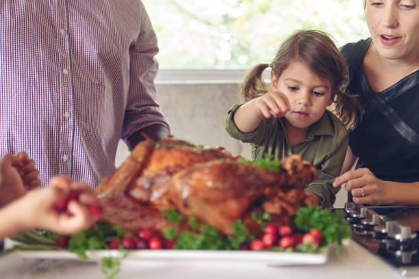 istock Fathers preparing thanksgiving turkey 1045384286