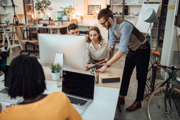 istock Office manager helping coworkers 1045386668