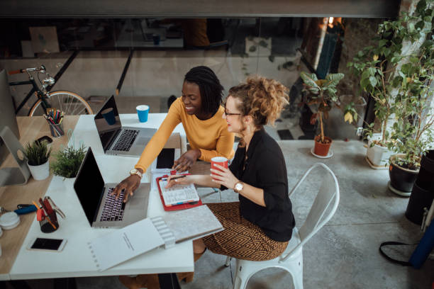 istock Two women working in a modern office 1045387034