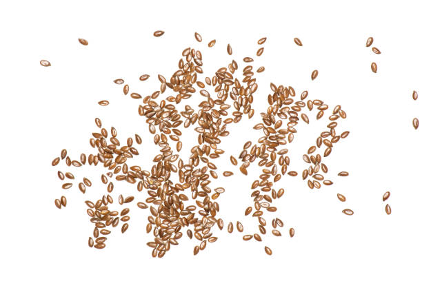 istock Fresh brown flaxseeds isolated on white 1045395678