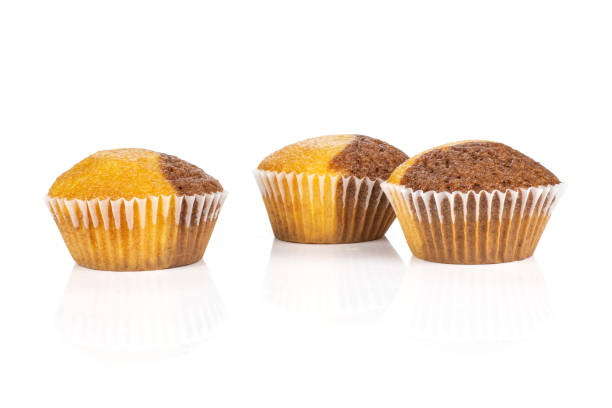 Fresh baked marble muffin isolated on white