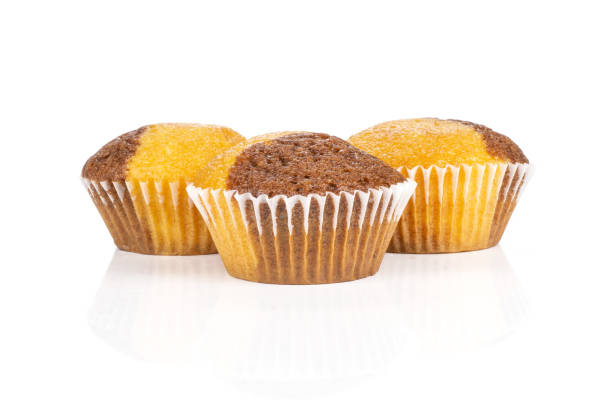 Fresh baked marble muffin isolated on white