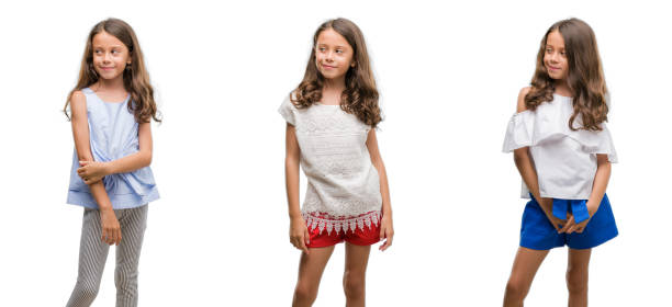 istock Collage of hispanic young child over isolated background smiling looking side and staring away thinking. 1045401904