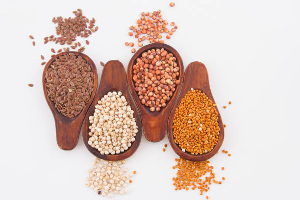 istock sorghum, millet and flaxseed in spoon. 1045404358