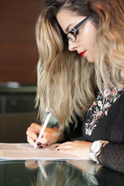 istock Young woman filling an application 1045408752