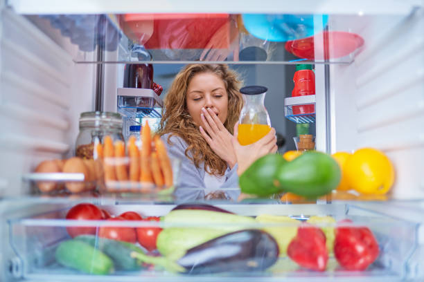 istock Woman taking juice from fridge. 1045409300