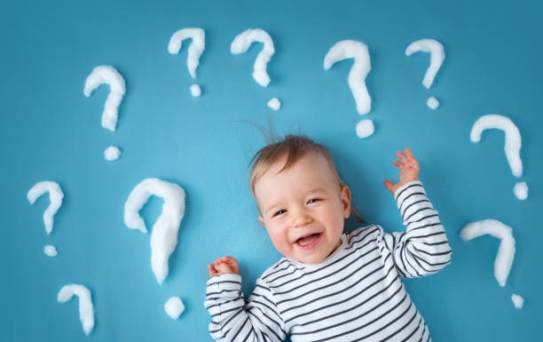 istock little boy with lots of question marks 1045409502