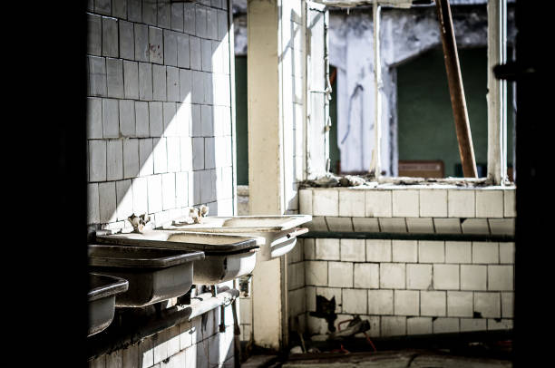 istock Abandoned factory restroom 1045409982