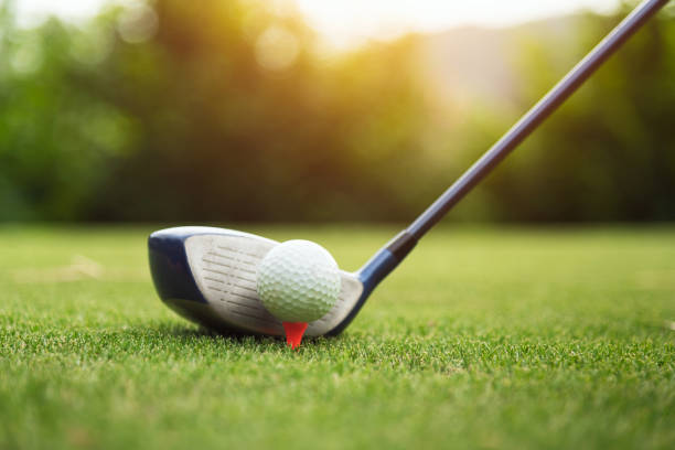 istock Golf ball on green grass ready to be struck 1045419802