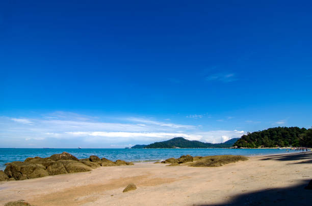 istock Beautiful tropical beach at sunny day with blue sky background 1045419828