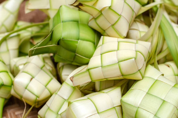 istock ketupat casing and rice in bamboo container 1045420440