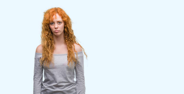 istock Young redhead woman depressed and worry for distress, crying angry and afraid. Sad expression. 1045421150