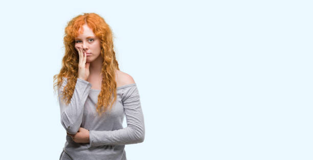 istock Young redhead woman thinking looking tired and bored with depression problems with crossed arms. 1045421414