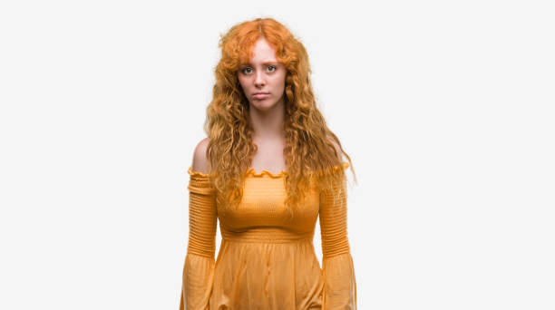 istock Young redhead woman depressed and worry for distress, crying angry and afraid. Sad expression. 1045425048