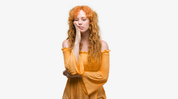 istock Young redhead woman thinking looking tired and bored with depression problems with crossed arms. 1045425380