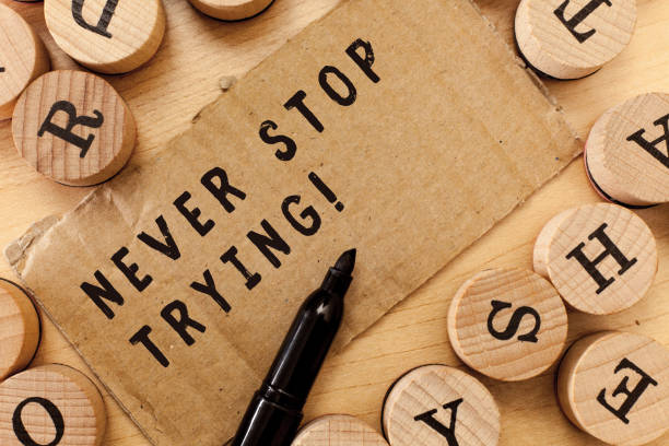 istock Handwriting text writing Never Stop Trying. Concept meaning Do not give up Continue to Try Again Keep on Doing 1045431580