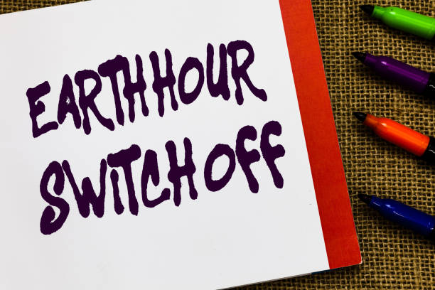 istock Handwriting text Earth Hour Switch Off. Concept meaning The Lights Out Event Annual Movement Planet Day Open notebook page jute background colorful markers Expressing ideas. 1045431652