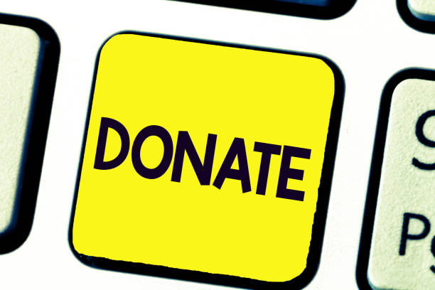 istock Handwriting text writing Donate. Concept meaning give money or goods for good cause for example to charity or people 1045431720