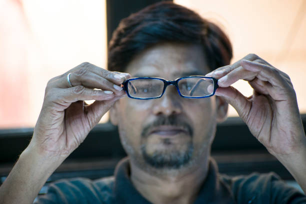 istock man is looking our eyeglasses 1045435336