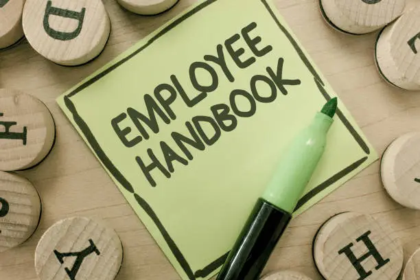 Photo of Conceptual hand writing showing Employee Handbook. Business photo showcasing Document that contains an operating procedures of company