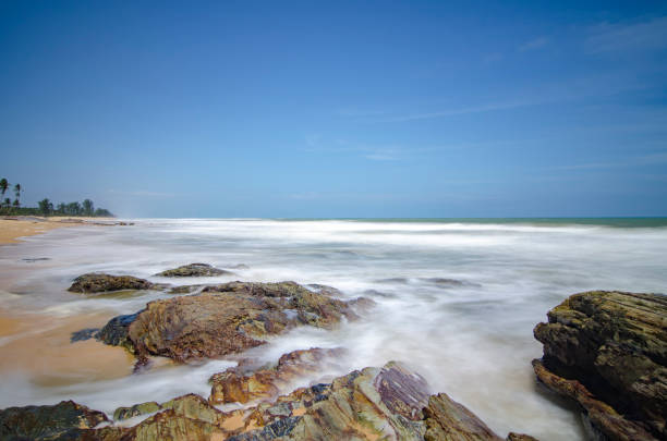 istock Beautiful tropical beach at sunny day with blue sky background 1045435482