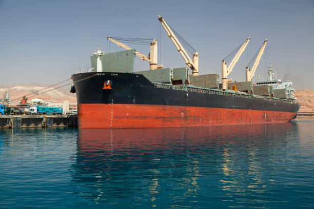 istock Bulk carrier loading in port of Aqaba 1045438030