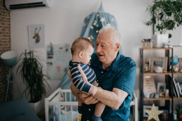 istock Grandfather playing with his little grandchild 1045440194