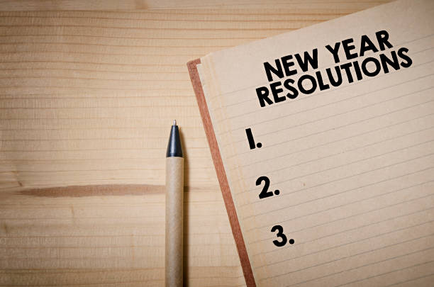 New Year Resolutions New Year Resolutions checklist on notebook on a wooden table 2019 new year resolution stock pictures, royalty-free photos & images