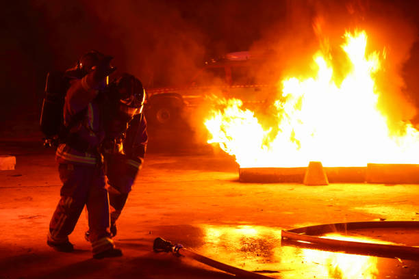 istock Firefighter helping injured friend 1045443832