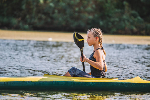 istock Paddling in a kayak - side view 1045444694
