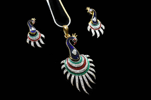 istock Fancy designer Diamond Chain pendent with earrings closeup macro image on black background 1045454150