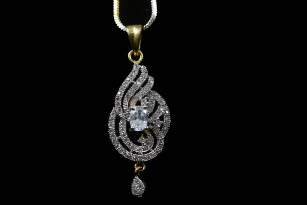 istock Fancy designer Diamond chain pendent closeup macro image on black background 1045454354