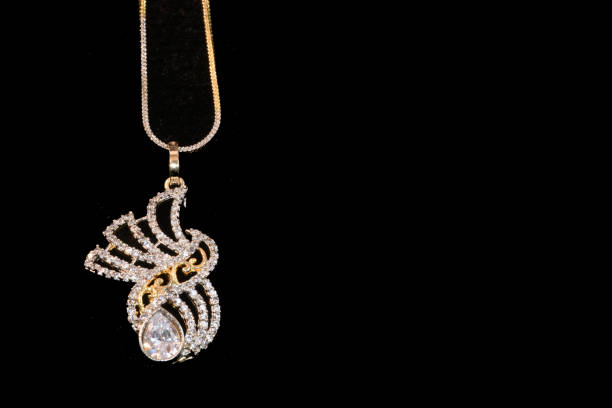 istock Fancy designer Diamond chain pendent closeup macro image on black background 1045454960