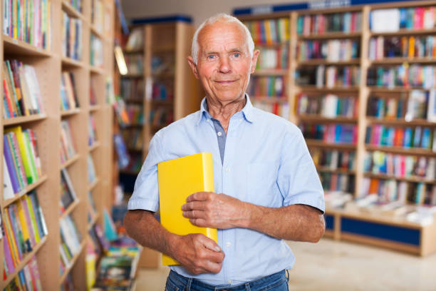 istock Happy elderly man in bookstore 1045455024