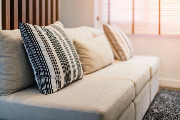 istock soft cozy pollows on modern sofa with wooden background home design concept 1045458174