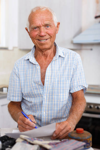 istock Enthusiastic man making list of repair works 1045458222