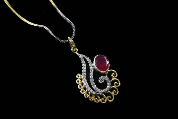 istock Fancy designer Diamond chain pendent closeup macro image on black background 1045458718