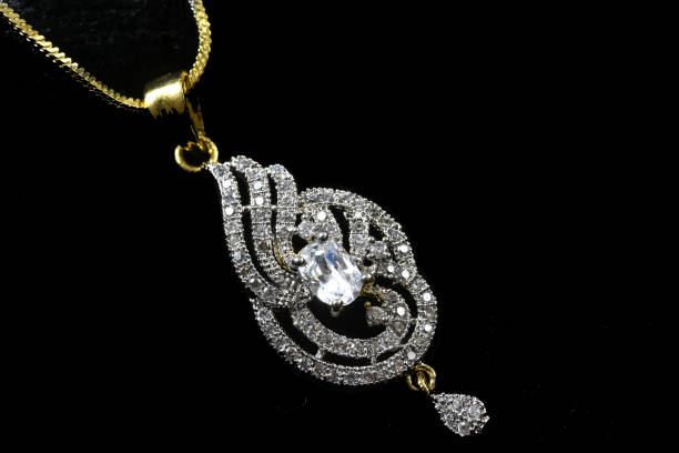istock Fancy designer Diamond chain pendent closeup macro image on black background 1045458982