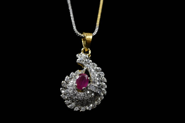 istock Fancy designer Diamond chain pendent closeup macro image on black background 1045459620