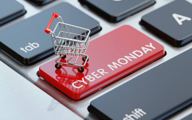 cyber pazartesi düğmesinde bir alışveriş sepeti ile modern bilgisayar klavye - cyber monday stok fotoğraflar ve resimler