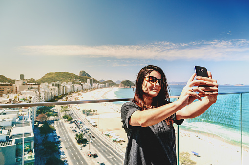 Young woman taking a selfie at Rio de Janeiro