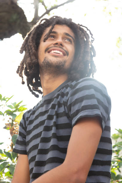 istock Handsome young rasta man outdoors looking away daydreaming 1045462526