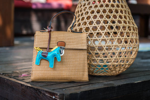 Woman's handbag from natural straw with pendant